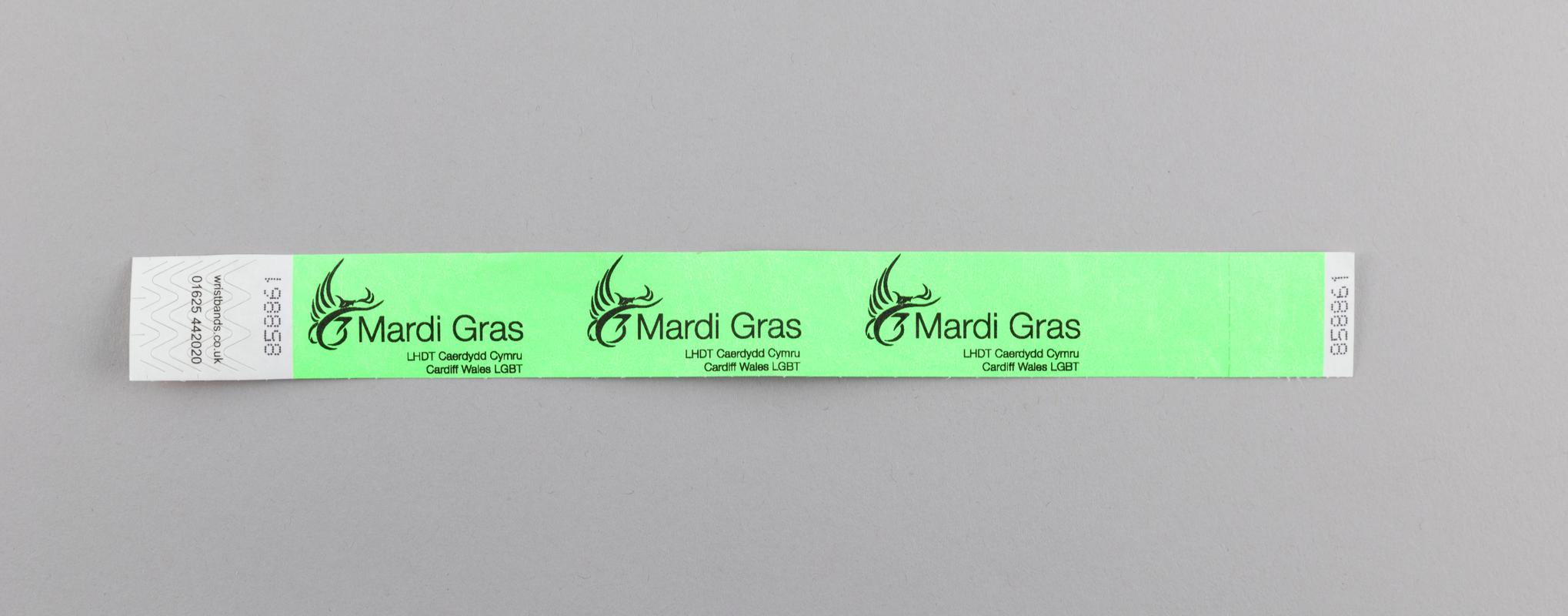 Green Cardiff Mardi Gras wrist strap.