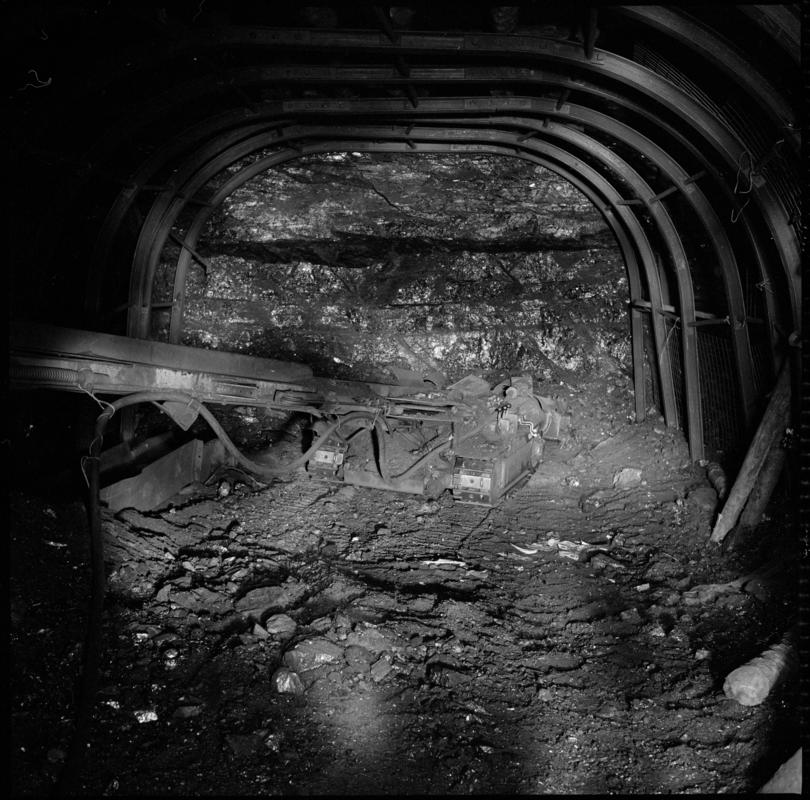 Black and white film negative showing a joy loader underground at Cwmgwili Colliery.  'Cwmgwili' is transcribed from original negative bag.