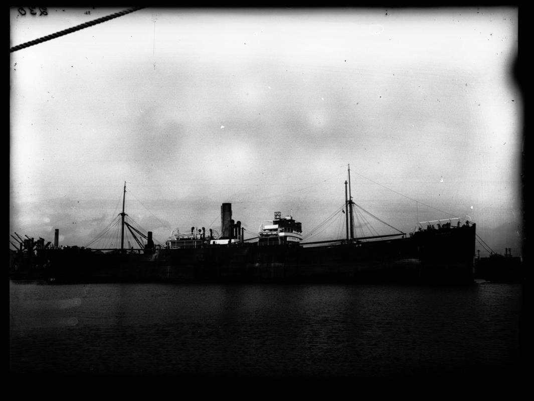 Starboard broadside view of S.S. HOLMPARK at Cardiff docks, c.1936.