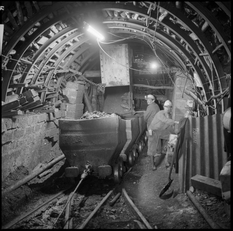 Black and white film negative showing an underground transfer point, Ammanford Colliery 7 September 1976.  'Ammanford 7 Sep 1976' is transcribed from original negative bag.