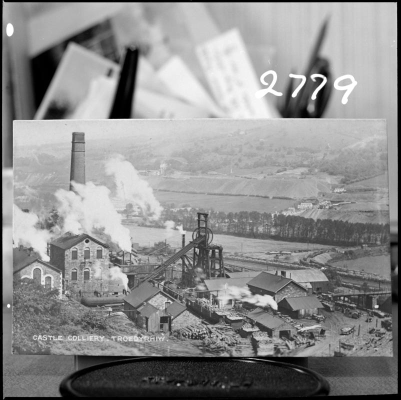 Black and white film negative of a photograph showing a surface view of Castle Colliery, Troedyrhiw, Merthryr Tydfil. 'Castle Pit Merthyr Tydfil' is transcribed from original negative bag.