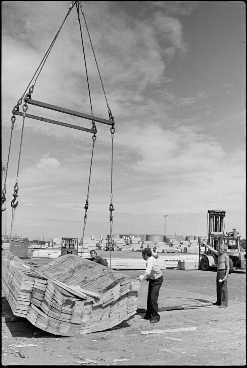 Load of timber just reaching the ground, Cardiff Docks. A vertical shot to show the contruction of the sling.