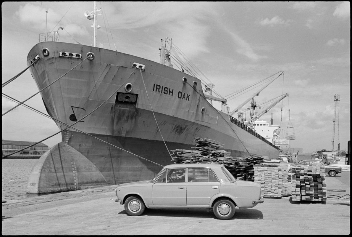 M.V. IRISH OAK off loading timber from British Columbia at Fletchers Wharf, Roath Dock, Cardiff.