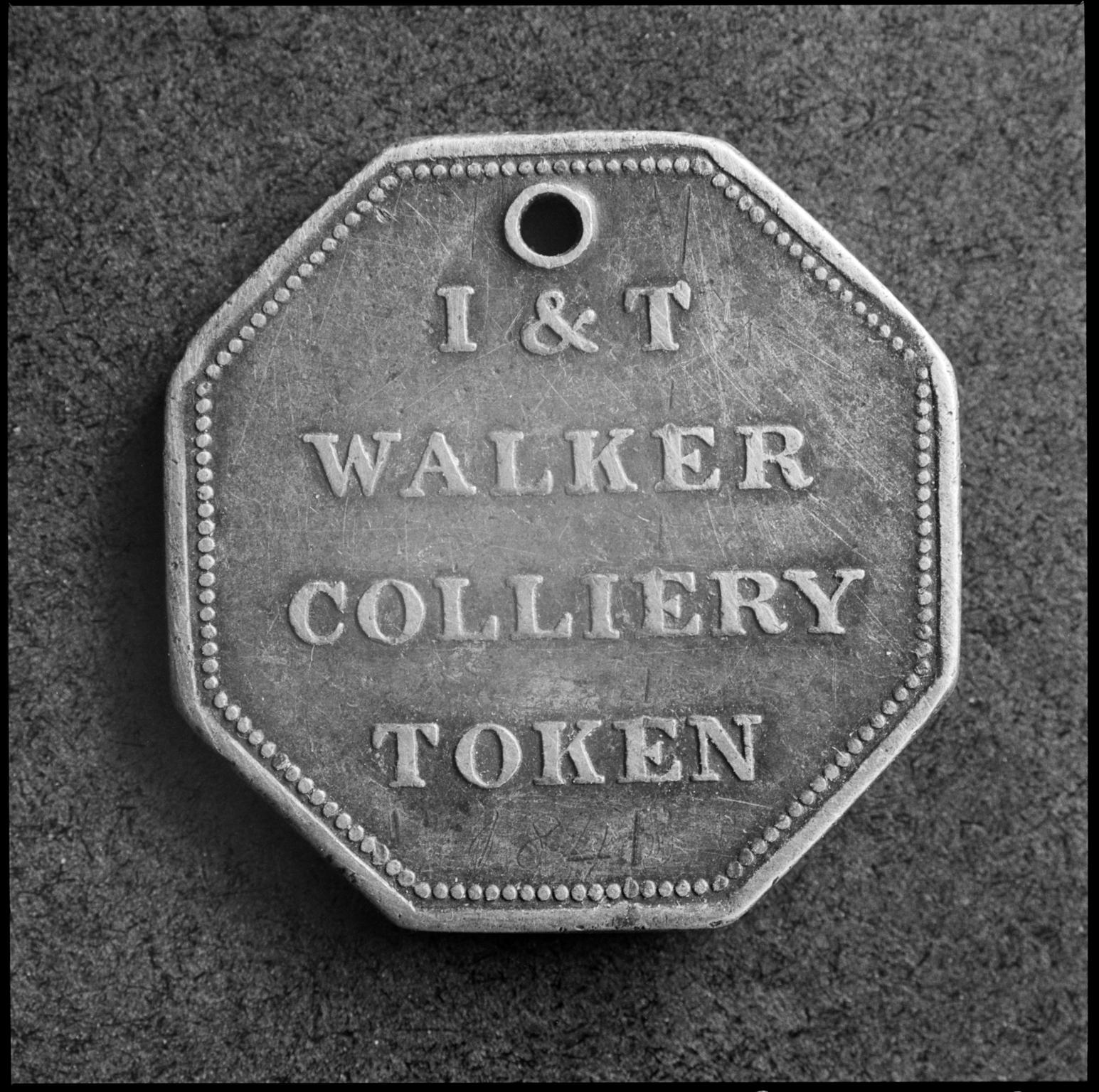 Colliery token, film negative