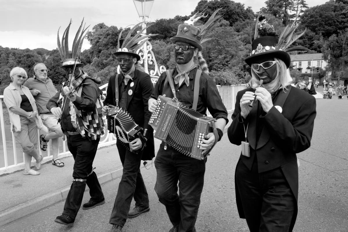GB. WALES. Chepstow. On 5 July 500 English in the guise of Morris Dancers and led by a marching band, invaded Wales over Chepstow Bridge. Chepstow festival. 2009.