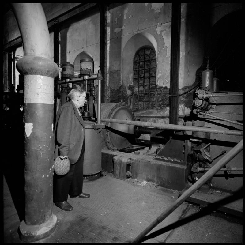 Black and white film negative showing George Watkins in the widing engine house, Elliot Colliery.  'East Elliot' is transcribed from original negative bag.