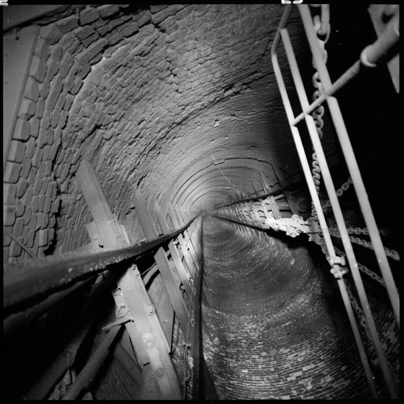 Black and white film negative showing a view looking up the Hetty shaft, Tymawr Colliery, March 1980.  'Hetty shaft Ty Mawr Colliery, March 1980' is transcribed from original negative bag.