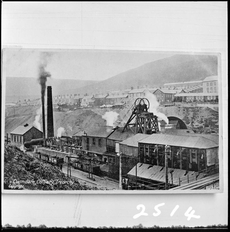 Black and white film negative of a photograph showing a surface view of Cwmdare Colliery. 'Cwmdare' is transcribed from original negative bag.