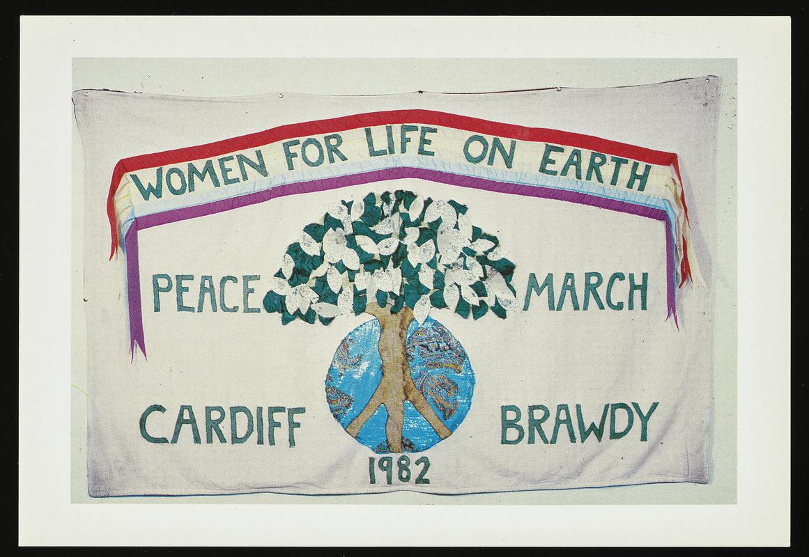 Colour postcard of a Women for Life on Earth Peace March Cardiff Brawdy 1982 banner. Original banner Designed and made by Liz Forder and the WFLOE (Cardiff) group.