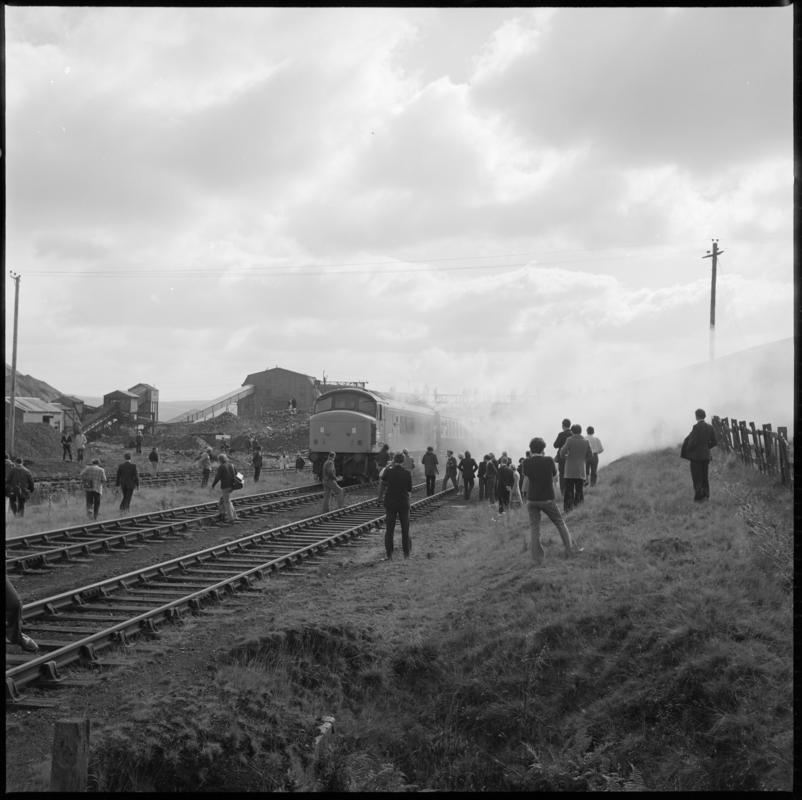 Black and white film negative showing a train passing the washery, Big Pit Colliery 1977.  'Blaenavon 1977' is transcribed from original negative bag.