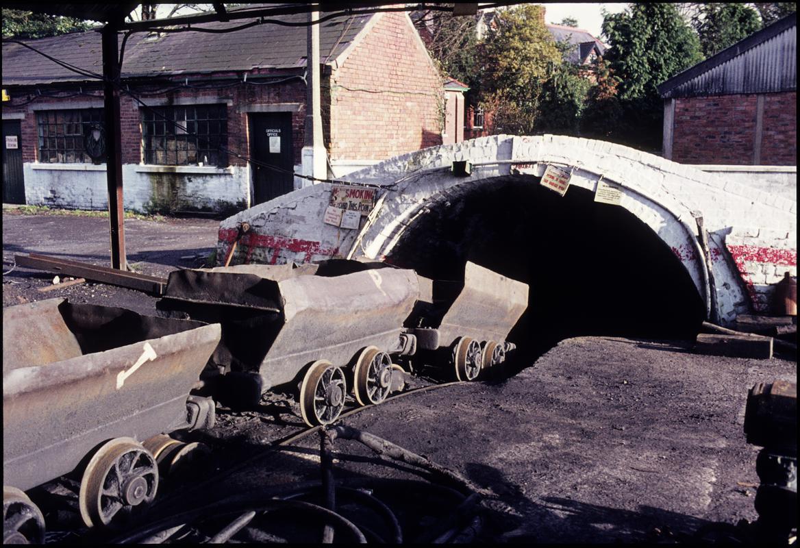 Colour film slide showing a journey of drams being lowered into the slant, Ammanford Colliery.