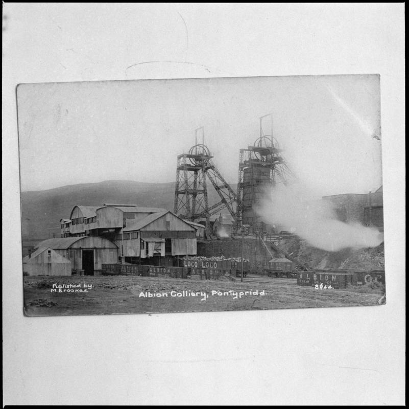 Black and white film negative of a photograph showing a surface view of Albion Colliery, Pontypridd.  'Albion' is transcribed from original negative bag.