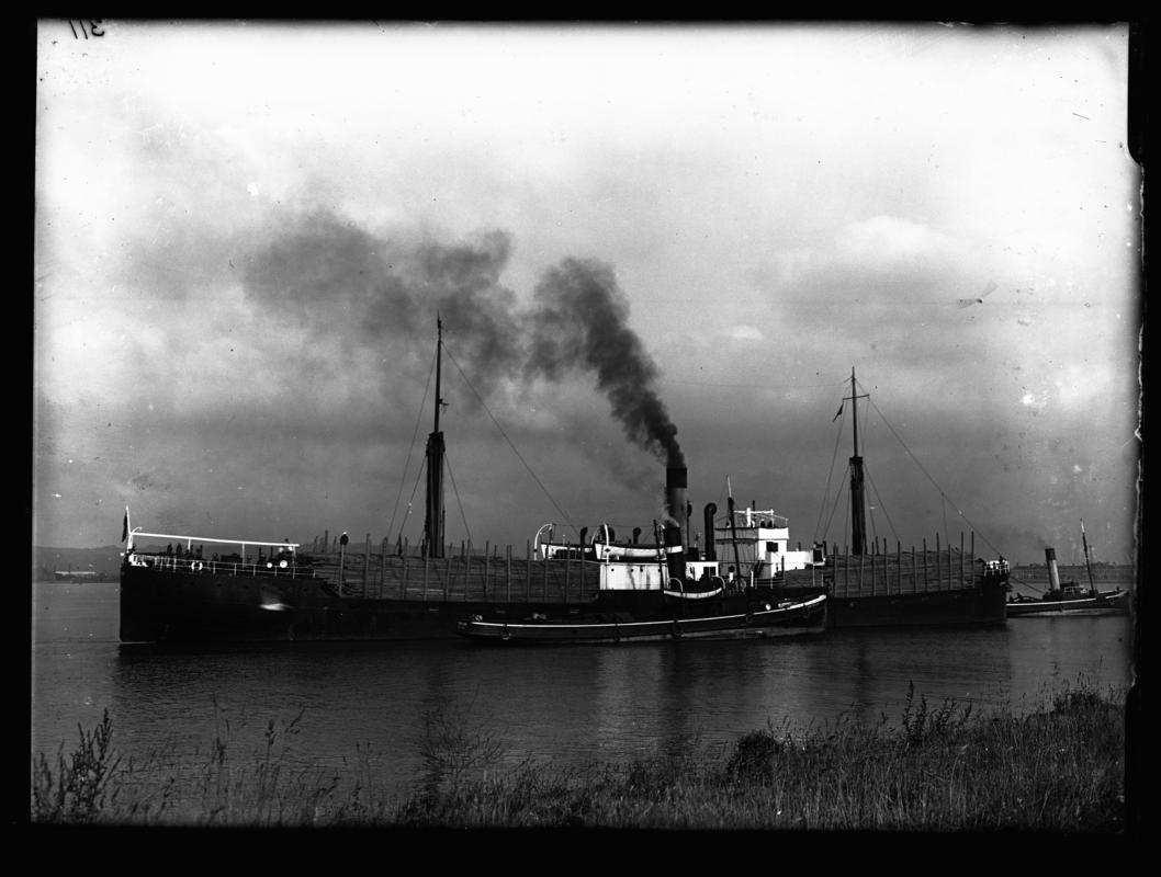 Starboard broadside view of S.S. GOTHIC and two tugs, one of which is the 'Cardiffian', c.1936.