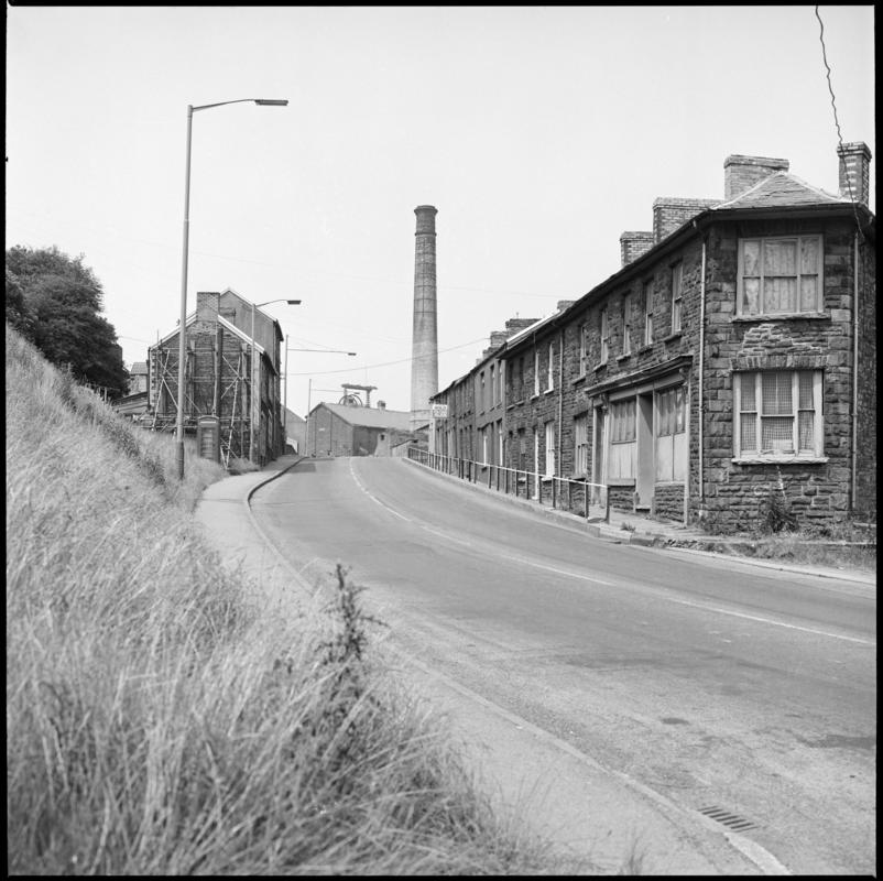 Black and white film negative showing houses, and Lewis Merthyr Colliery in the background.  'Lewis Merthyr' is transcribed from original negative bag.