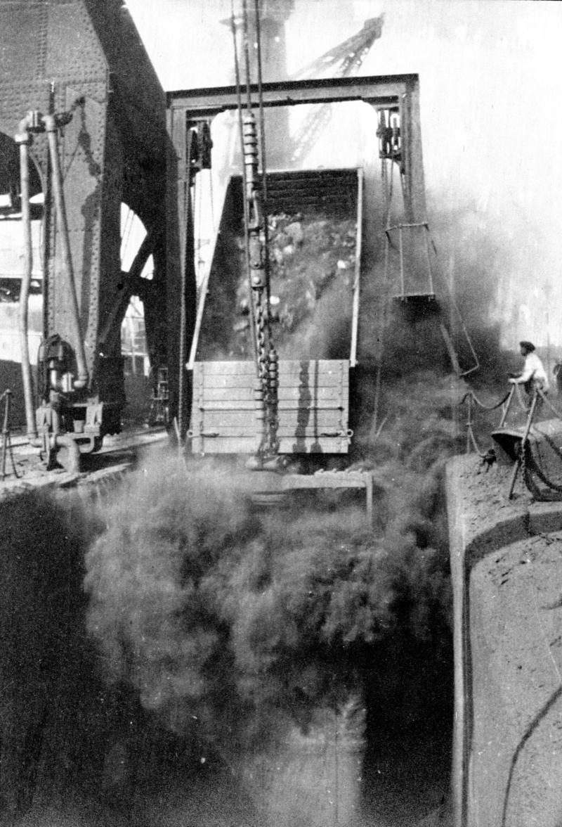 Tipping coal from railway wagon into a Lewis Hunter coaling box