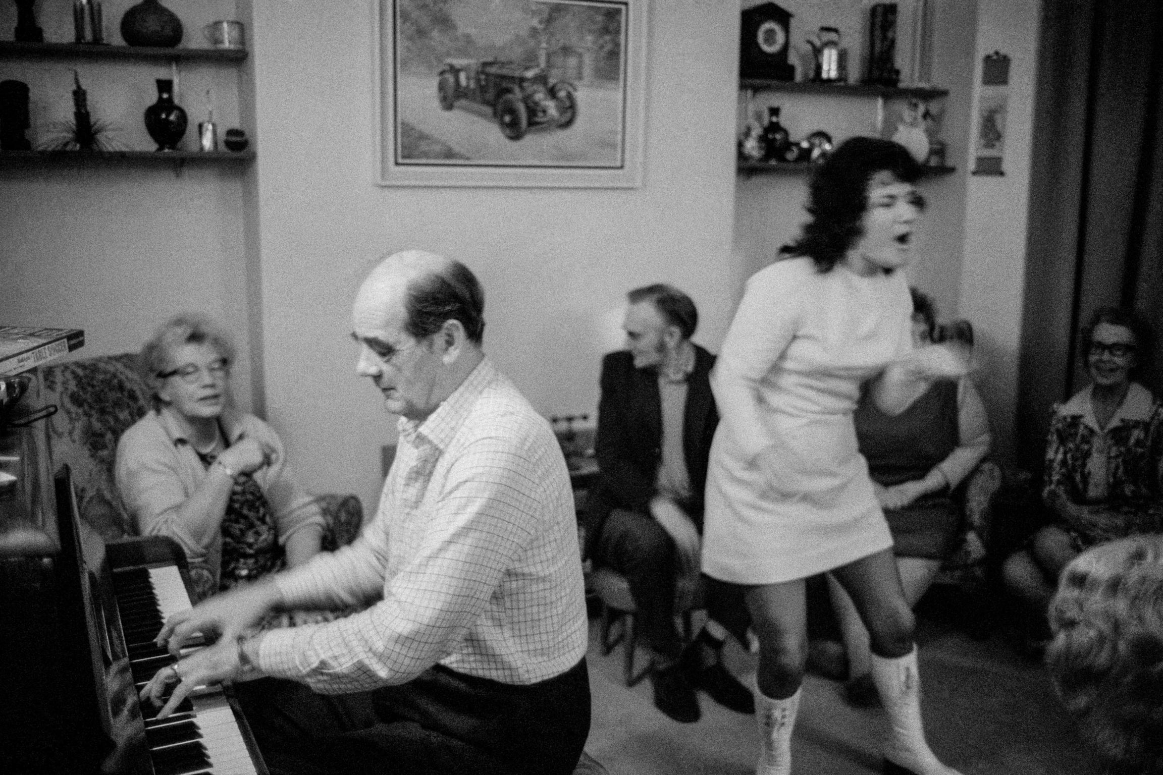 Family Christmas party. Stan Hurn on the piano. Cardiff, Wales