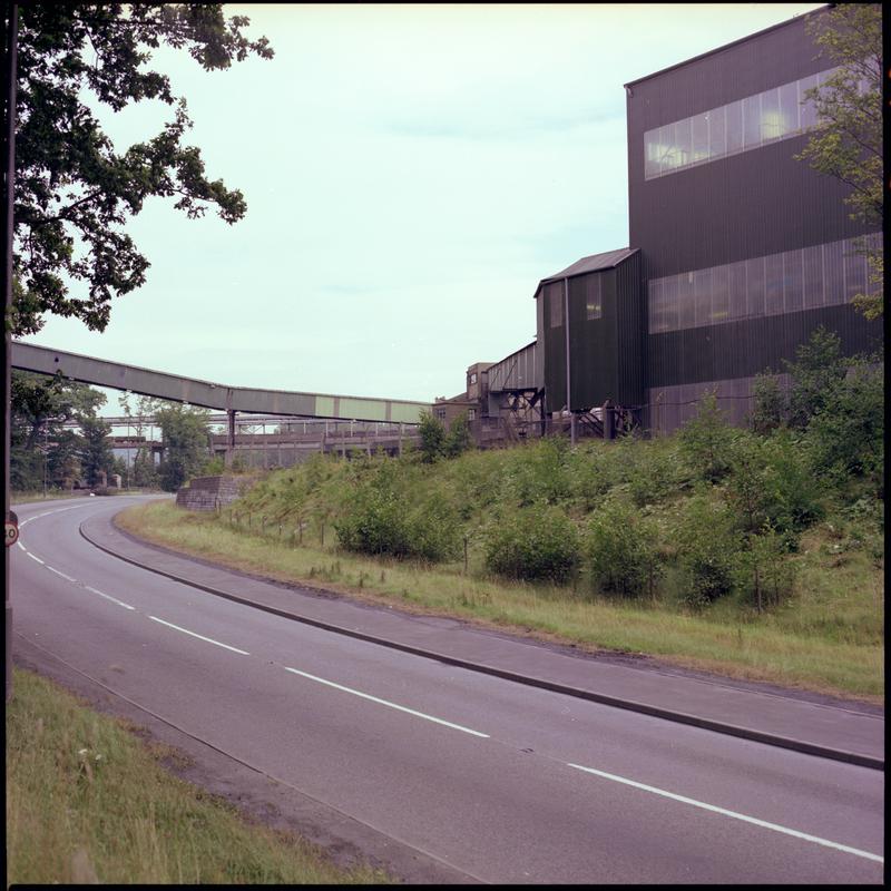 Colour film negative showing a surface view of Aberpergwm Colliery.  'Aberpergwm' is transcribed from original negative bag.