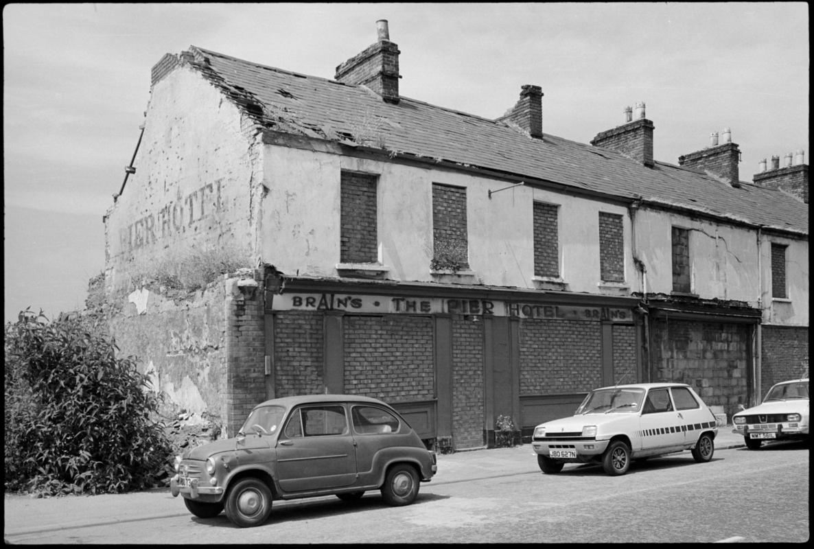 Exterior view of the bricked up Pier Hotel, Bute Street, Butetown.