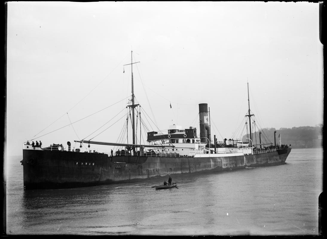Three quarter Port bow view of S.S. FOTIS and waterman's boat at Penarth Head, c.1936.