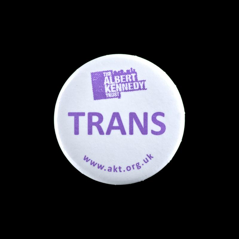Badge 'The Albert Kennedy Trust Trans'.
