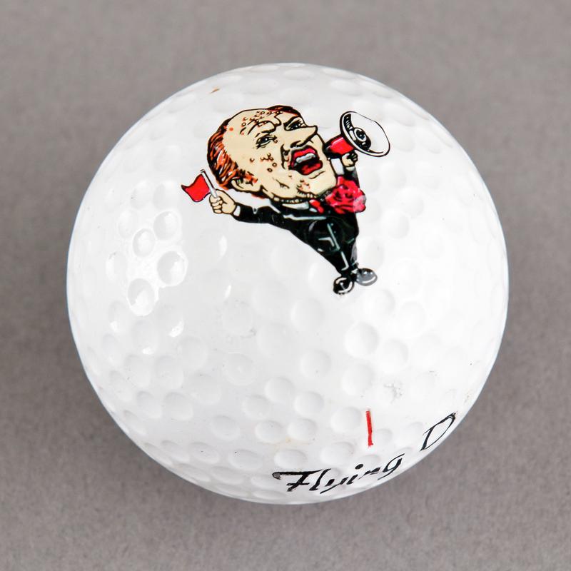 Golf ball with caricature of Neil Kinnock. Sold during 1984-85 Miners' Strike.