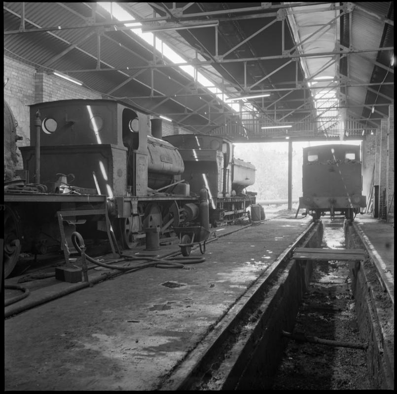 Black and white film negative showing locomotives inside a locomotive shed, Mountain Ash.  'Mountain Ash locos' is transcribed from original negative bag.