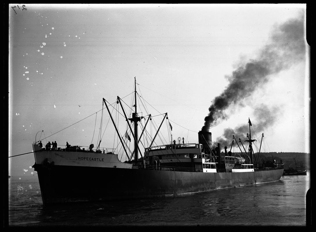 Starboard broadside view of S.S. HOPECASTLE entering Cardiff docks,  c.1936.