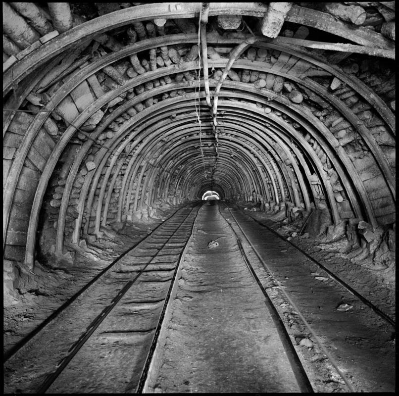 Black and white film negative showing an underground roadway, Deep Duffryn Colliery 1978.  'Deep Duffryn 1978' is transcribed from original negative bag.