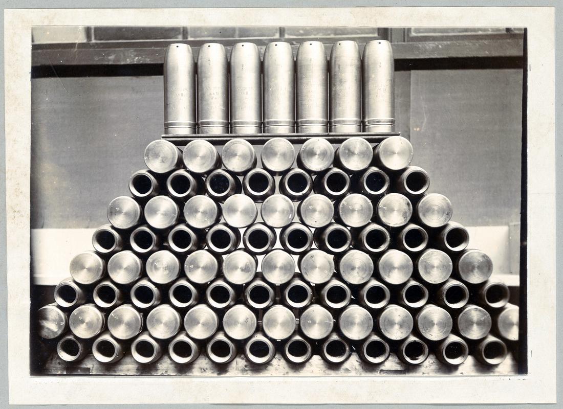 Display showing "The first consignment of 18 PDR 3.3 High Explosive Shells from Ebbw Vale National Shell Factory."
