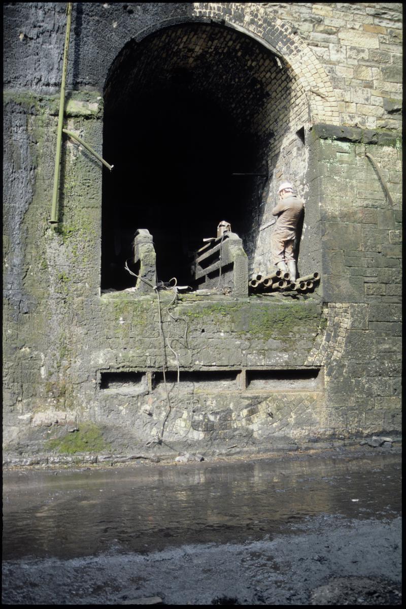Colour film slide showing an access tunnel into shaft, unknown colliery.