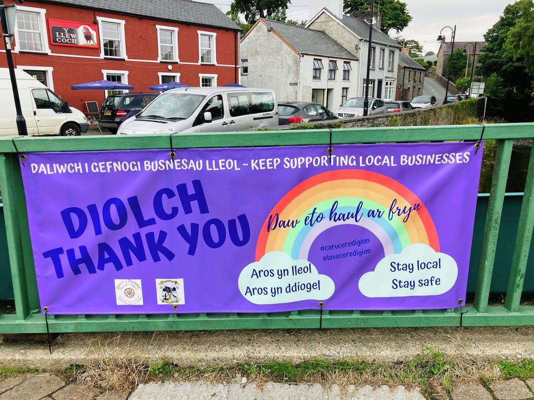 Sign thanking people for supporting local business in Tregaron, Ceredigion.