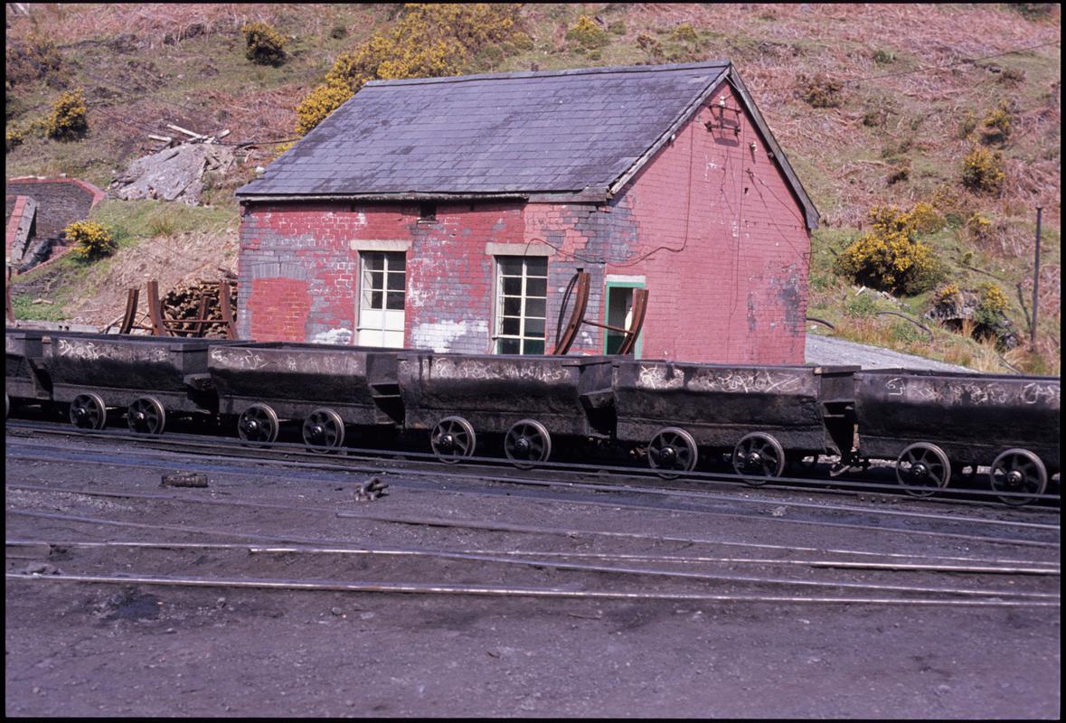 Colour film slide showing Graig Merthyr Colliery yard and a long journey of drams.