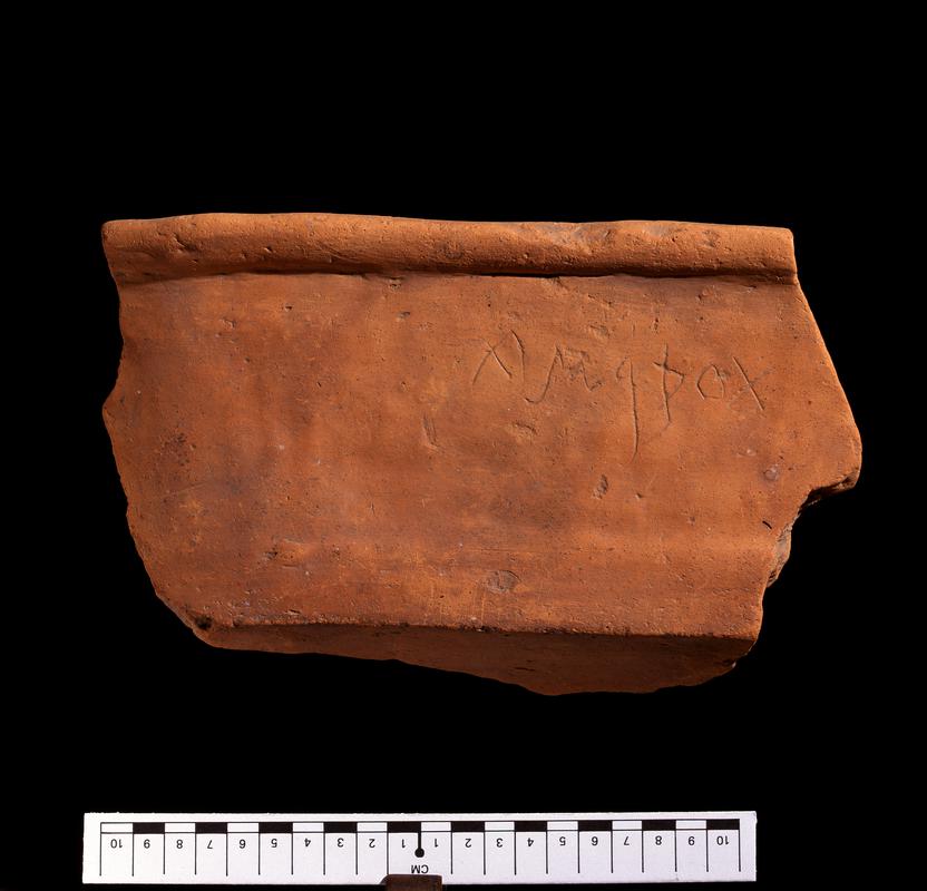 Roman pottery flanged dish with graffito