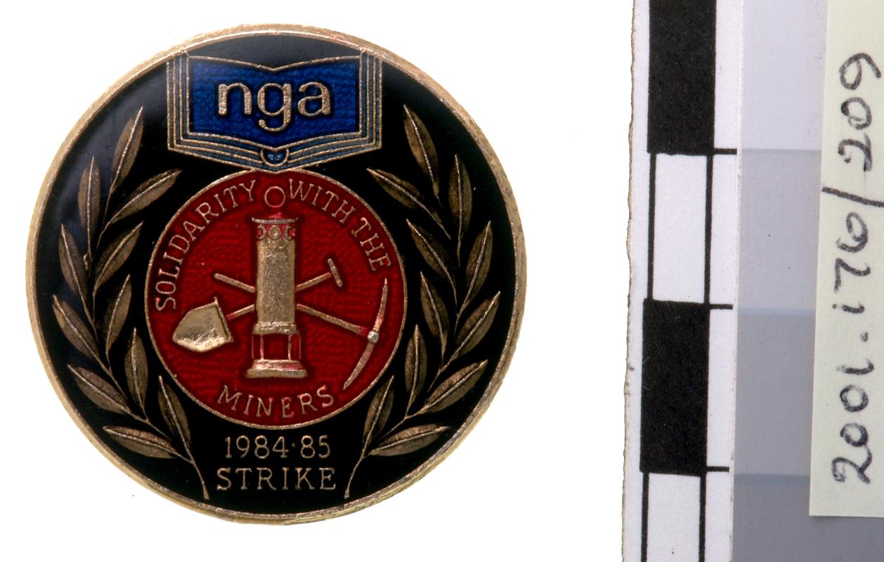 N.U.M badge