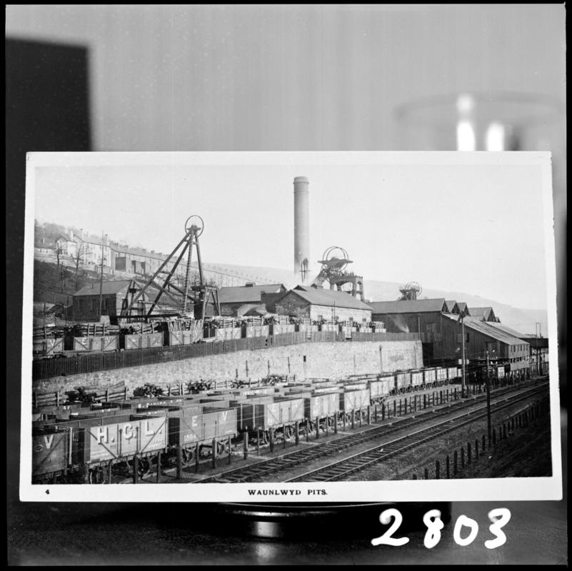 Black and white film negative of a photograph showing a surface view of Waunlwyd Colliery c.1900.  'Waunlwyd' is transcribed from original negative bag.