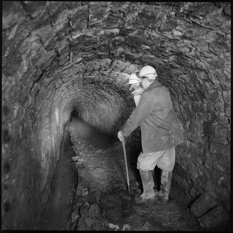Black and white film negative showing man at River Arch, Big Pit Colliery.  'Big Pit Blaenavon' is transcribed from original negative bag.