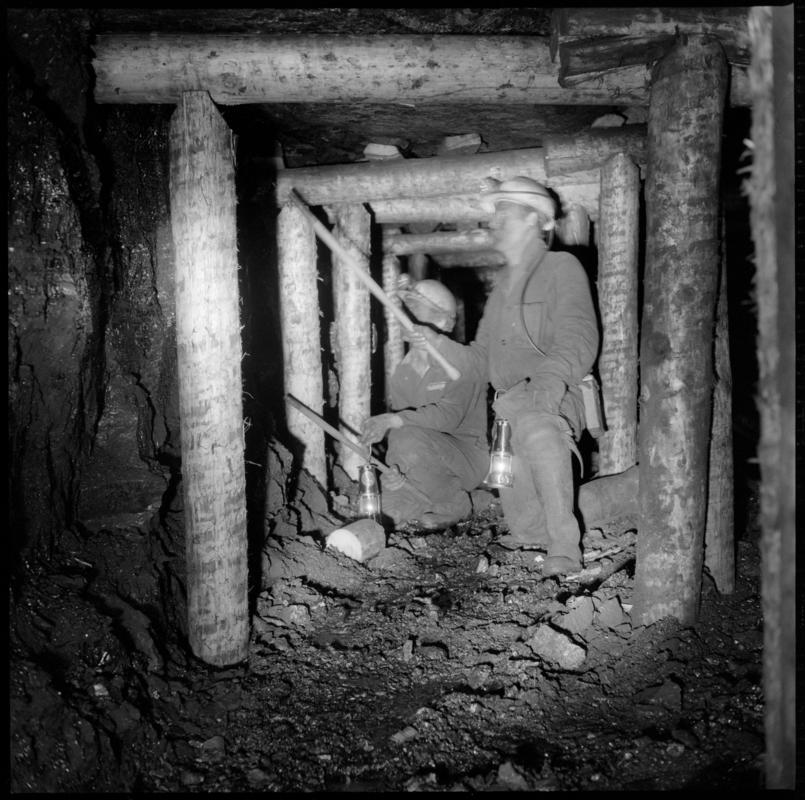 Black and white film negative showing men preparing timber on the face, Ammanford Colliery 7 September 1976.  'Ammanford 7 Sep 1976' is transcribed from original negative bag.