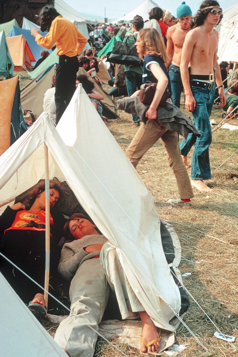 GB. ENGLAND. Isle of Wight Festival. Waking up in a tent gives you a wonderful free feeling. Add to this the first brushing of your hair and you have pure bliss. 1969.