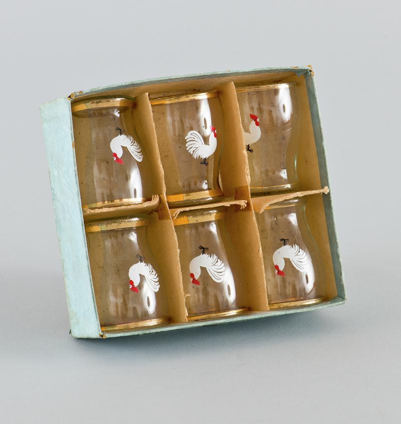 Set of six small glasses with white cockerel motif on the front. In card box.
