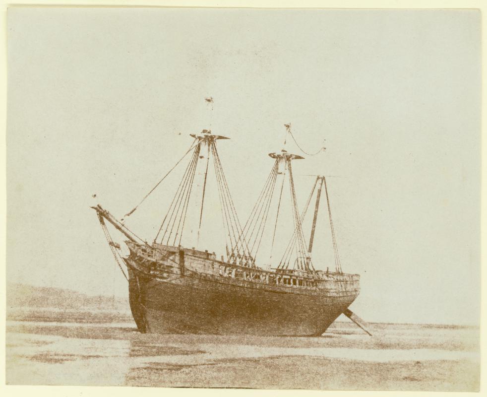 three masted barque on beach, photograph