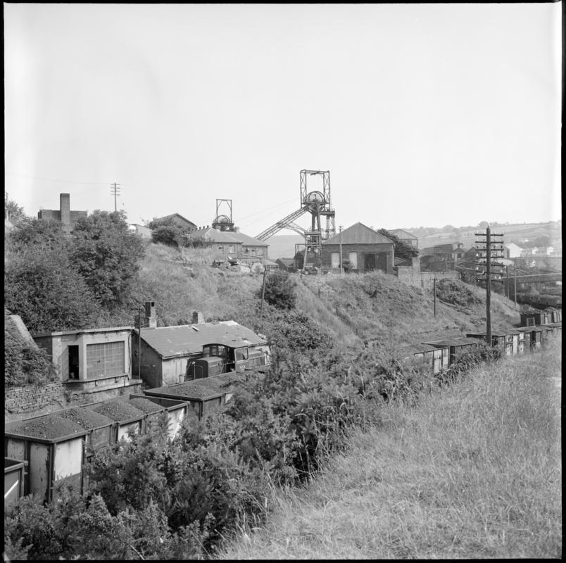 Black and white film negative showing a surface view of Deep Navigation Colliery 1975.  'Deep Navigation Treharris 1975' is transcribed from original negative bag.