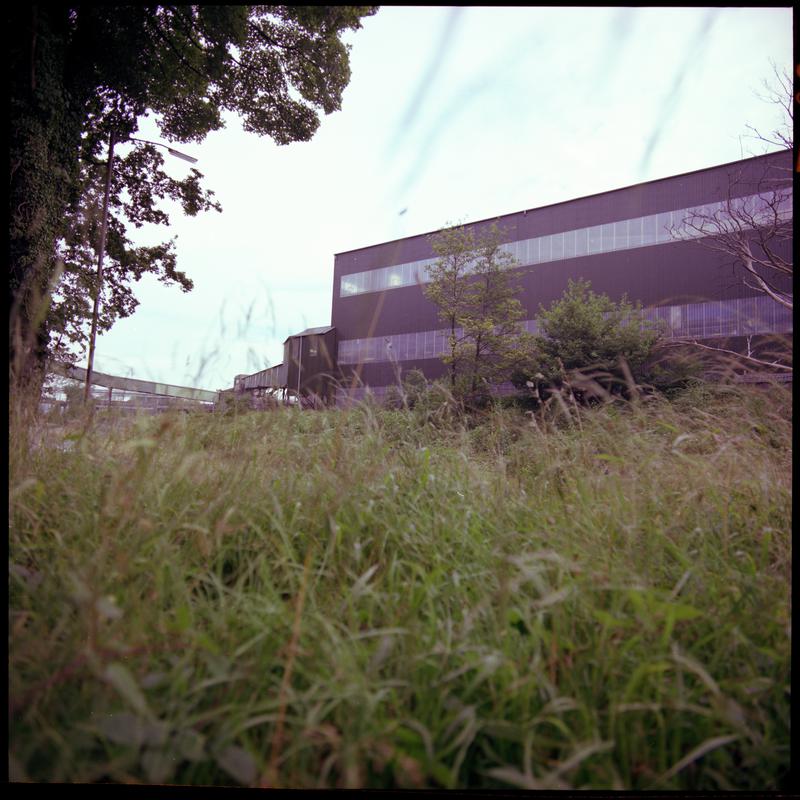 Colour film negative showing a surface view of Aberpergwm Colliery.  'Aberpergwm' is transcribed from original negative bag.  Appears to be identical to 2009.3/1896.