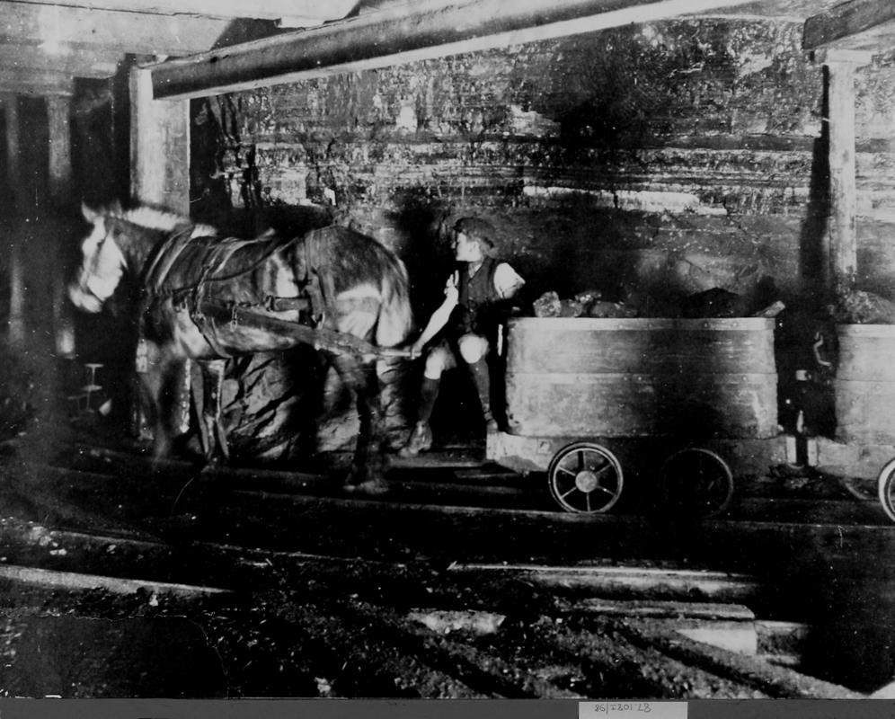 Miner underground, photograph