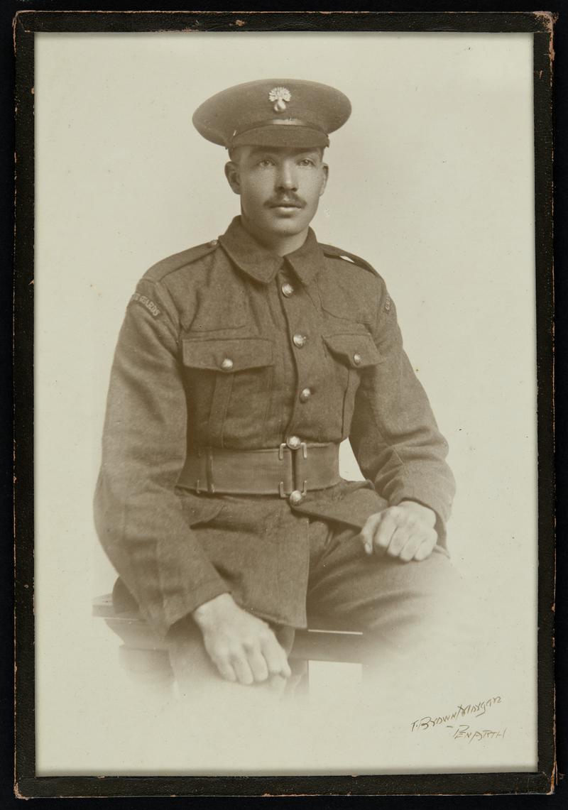 Framed studio portrait of Corporal Oscar Foote of the Grenadier Guards in military uniform. Photograph taken by T. Brown Morgan of Penarth on 31 October 1916