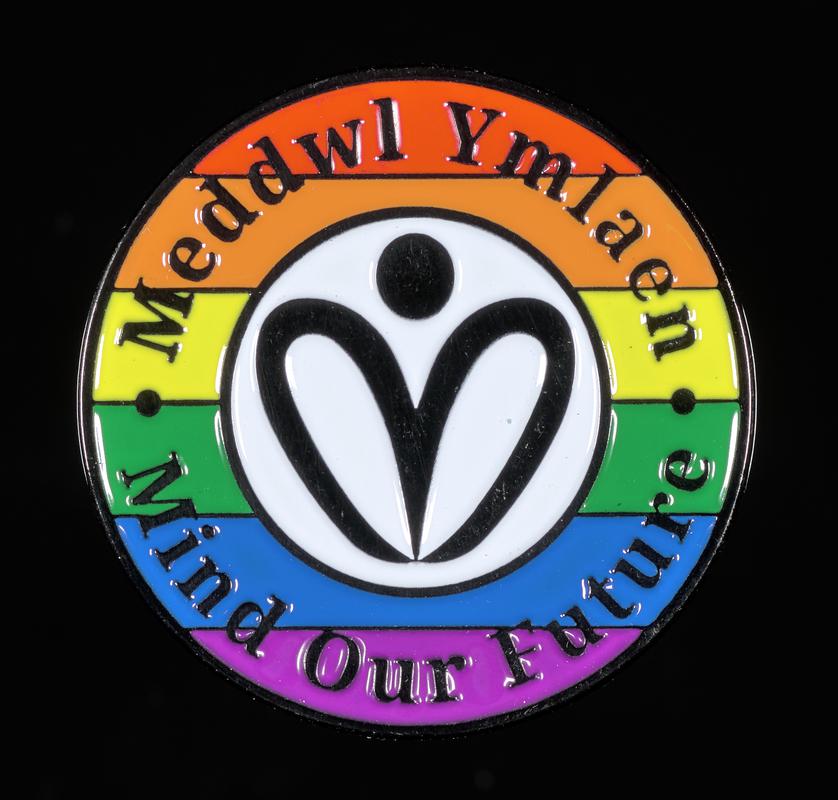 Badge 'Meddwl Ymlaen / Mind Our Future'. Given out at the first Wrexham Pride, Saturday 27 July 2024.