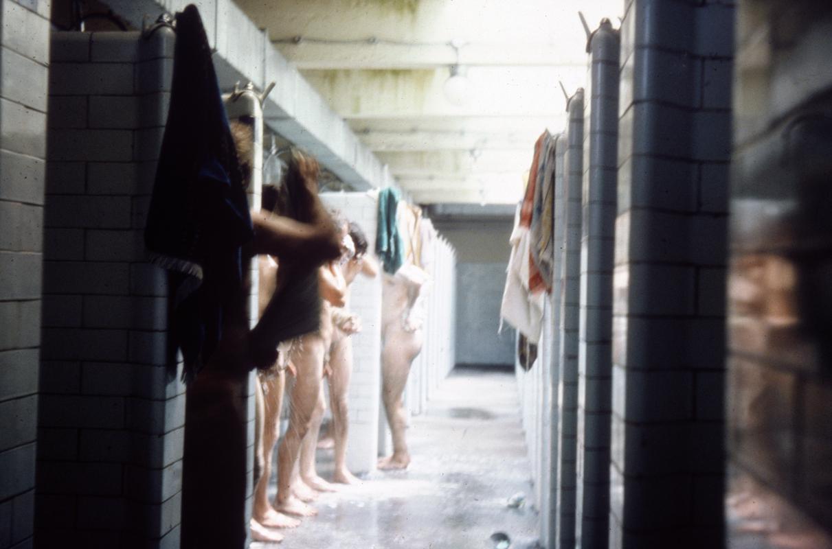 Day shift workers washing in the pit head baths, Big Pit Colliery.
