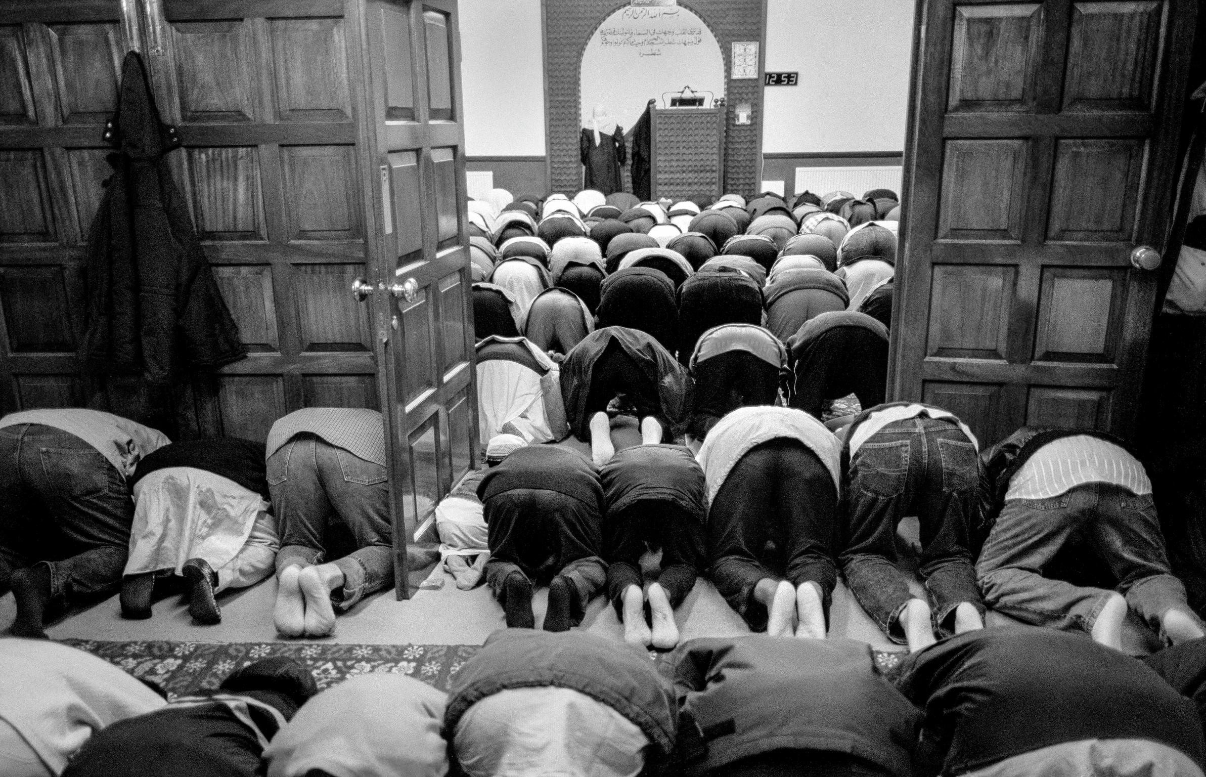 Prayer time inside the Alice Street Mosque in Butetown. Cardiff, Wales