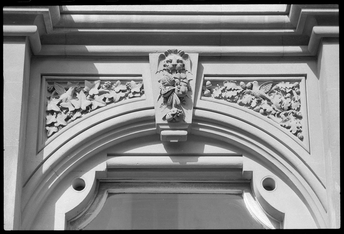 Decorated stonework over doorway to Midland Bank, Bute Street.