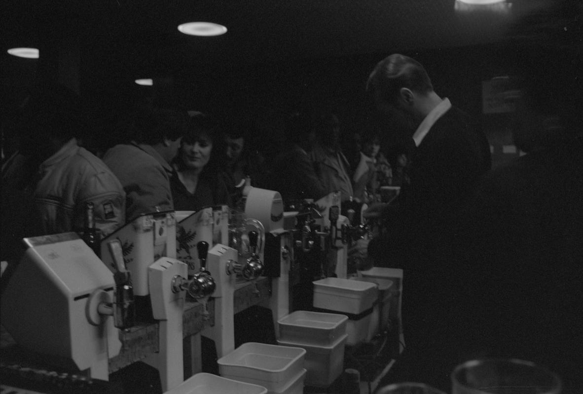 Staff behind bar at the Dowlais, Butetown.