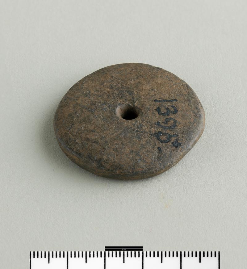 Iron Age / Roman slate spindle whorl